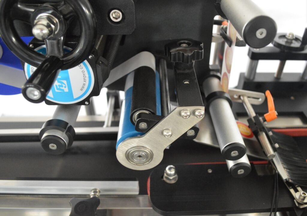 : Precision rollers guiding label material during application