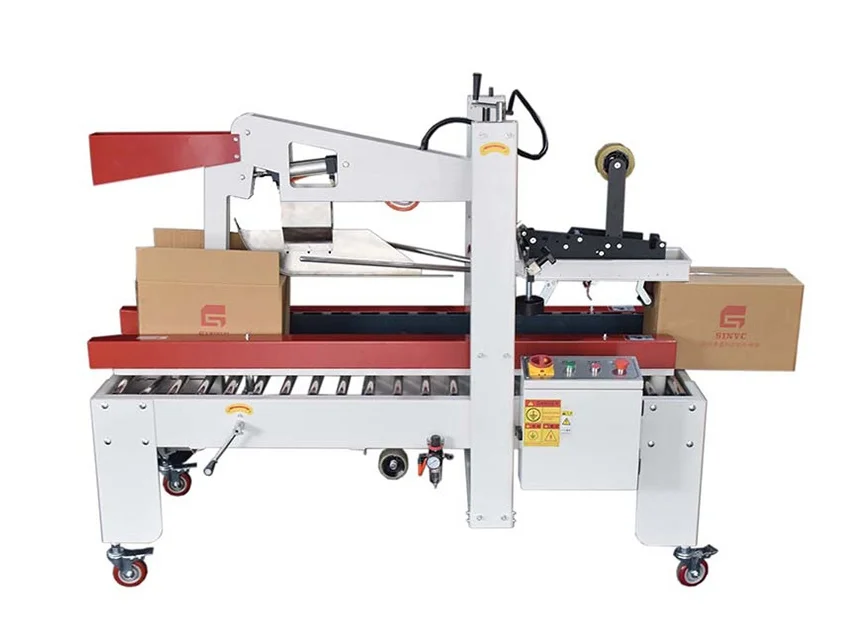 Carton sealing machine taping cardboard boxes on a conveyor belt.