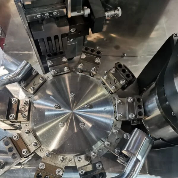 Close-up of circular filling system with stainless steel parts