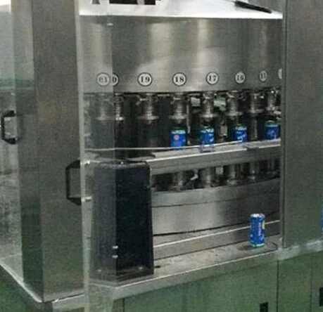 Multi-nozzle liquid filling line operating in factory environment