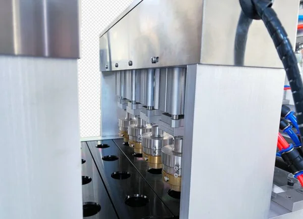 Automatic bottle filling machine operating in factory environment