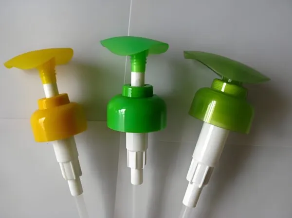 Plastic pump dispensers in different colors for bottles