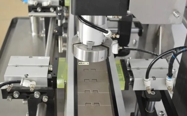 Automatic capping machine tightening caps on containers