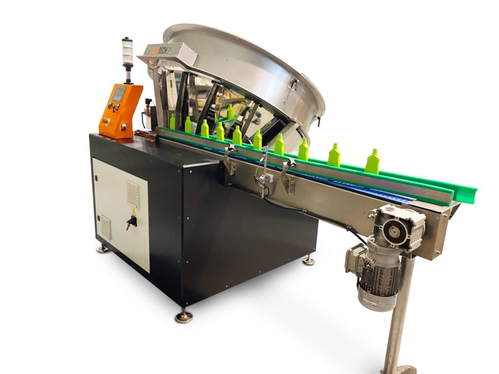 Automatic bottle unscrambler machine feeding plastic bottles into a packaging line
