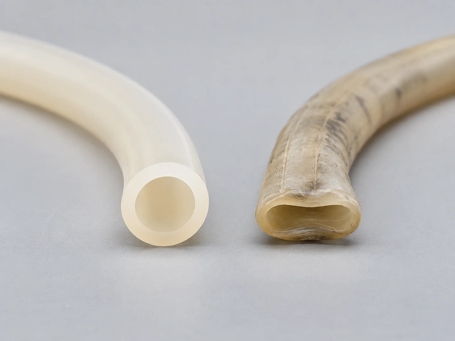 New and worn tubing used in a peristaltic filling machine for maintenance comparison