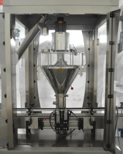 A stainless steel Powder Filling Machine stands in a factory setting, featuring a transparent front panel, various control buttons, and a conveyor belt beneath the filling nozzle.