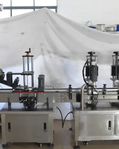 Close-up of the filling and capping machinery in action