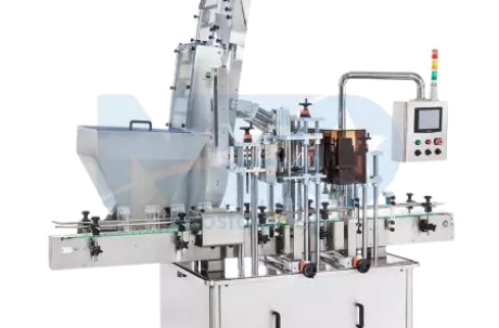 An industrial capping machine featuring a vertical cap elevator and sorter designed for high-capacity automated production lines.
