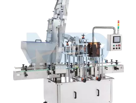 An industrial capping machine featuring a vertical cap elevator and sorter designed for high-capacity automated production lines.