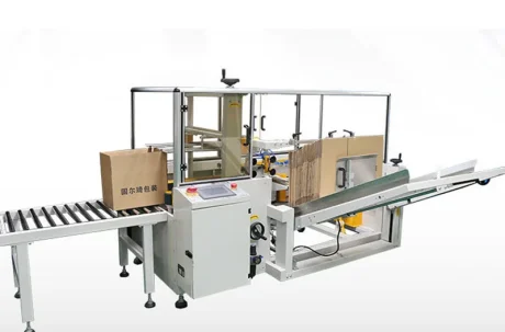 Carton Packaging Machine: Automated system packaging boxes on a conveyor belt.