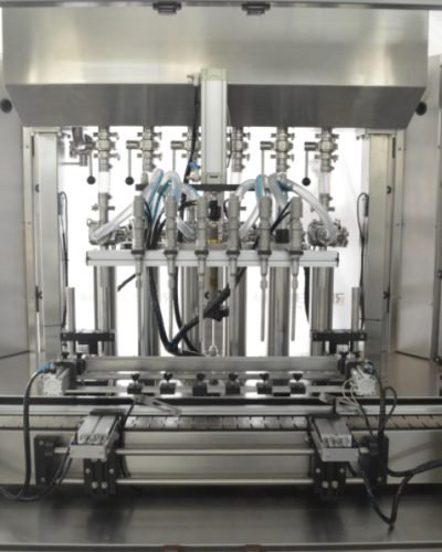 Stainless steel bottle filling heads inside automatic filling machine