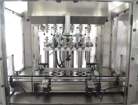Stainless steel bottle filling heads inside automatic filling machine