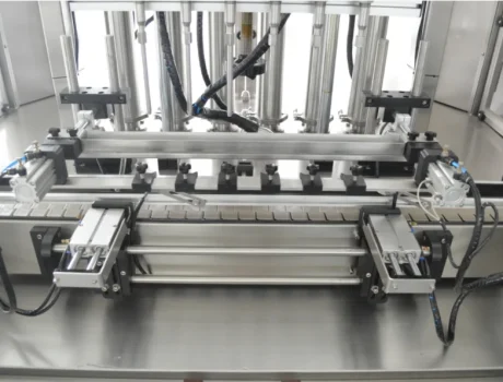 Close-up of a multi-nozzle filling machine for liquid packaging