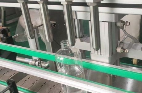 Stainless steel conveyor system connected to filling equipment