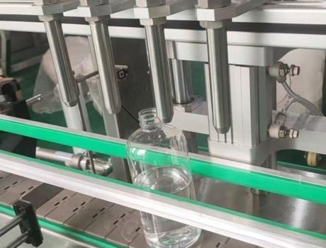 Stainless steel conveyor system connected to filling equipment