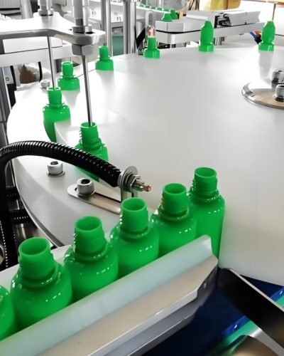Automatic bottle filling machine handling plastic containers