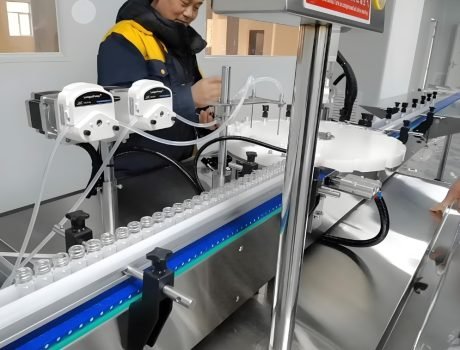 : Technician monitoring industrial filling machine during operation