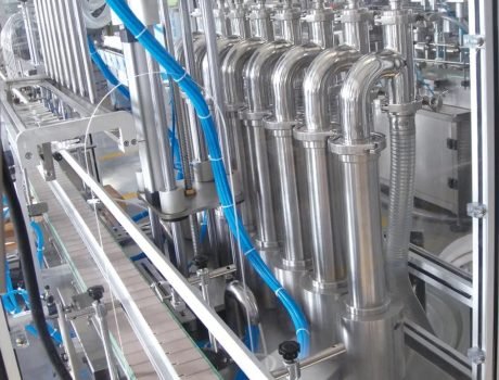 Stainless steel liquid filling nozzles aligned in production line