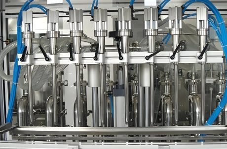 Vertical piston filling machine with multiple stainless steel nozzles