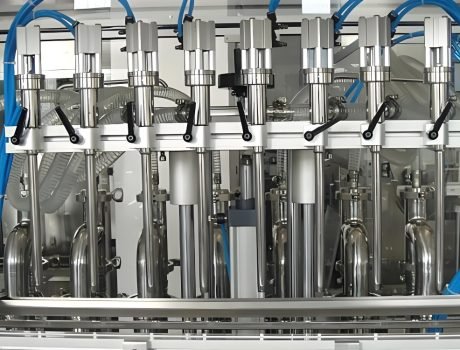 Vertical piston filling machine with multiple stainless steel nozzles
