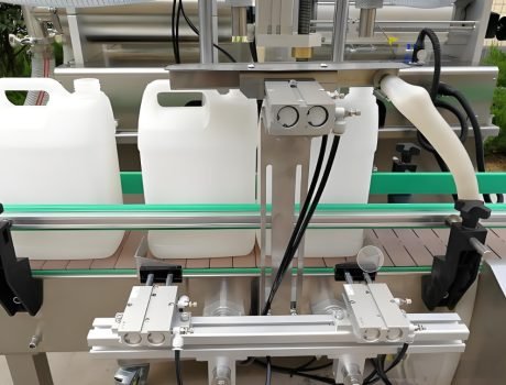 Plastic containers moving on conveyor toward filling station