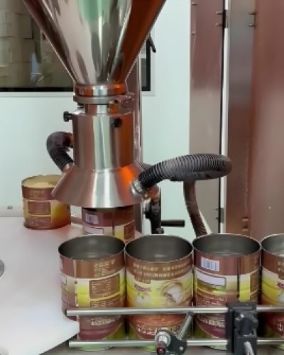 Industrial powder filling machine operating in factory