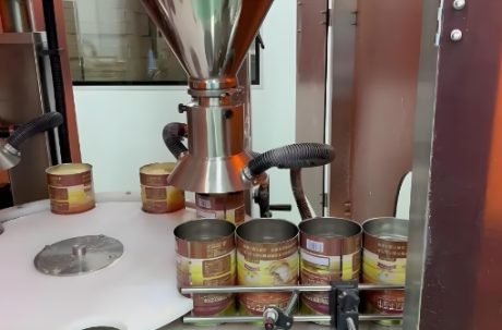 Industrial powder filling machine operating in factory