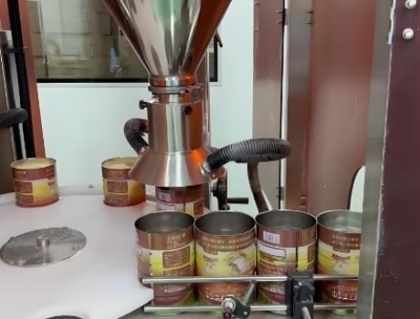 Industrial powder filling machine operating in factory