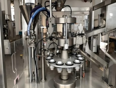 Automated filling machine filling cosmetic tubes in a production line