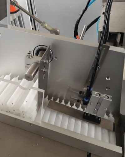 Empty cosmetic jars aligned for automated filling process