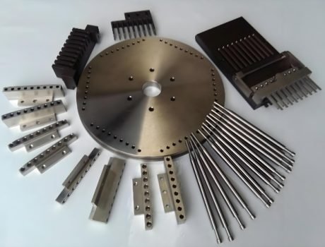 Various capsule molds and parts used for pharmaceutical production machines