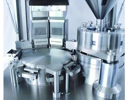 Close-up of pharmaceutical capsules being processed by automated machinery.