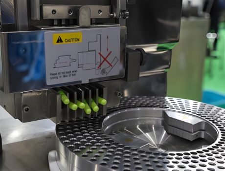 Capsule production line with high-speed filling and sorting machines.