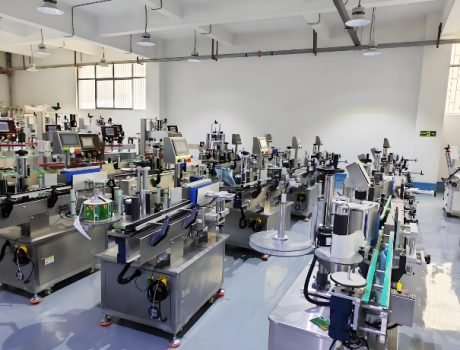 Automated labeling machines in a large-scale production facility.