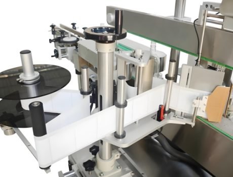 Automated labeling system for labeling and packaging containers in bulk.